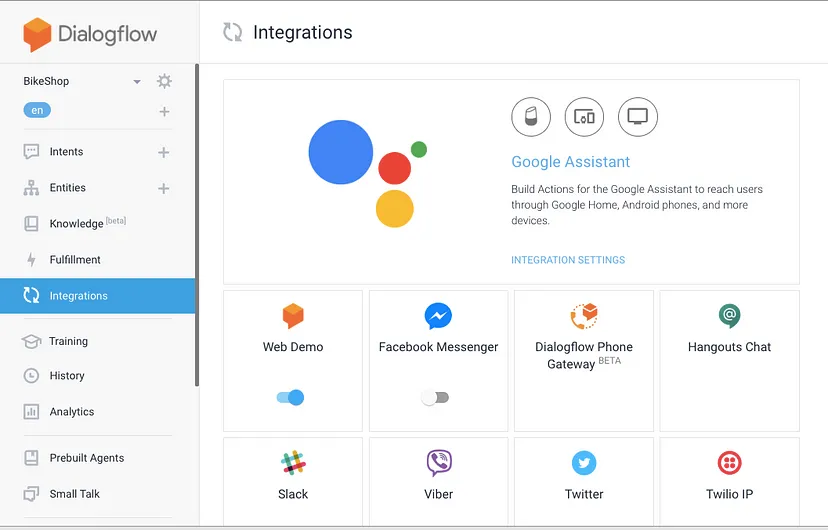 Interface do Dialogflow mostrando a seção 'Integrações' com Google Assistant e várias opções de plataforma de mensagens como Facebook Messenger, Slack e Twitter.